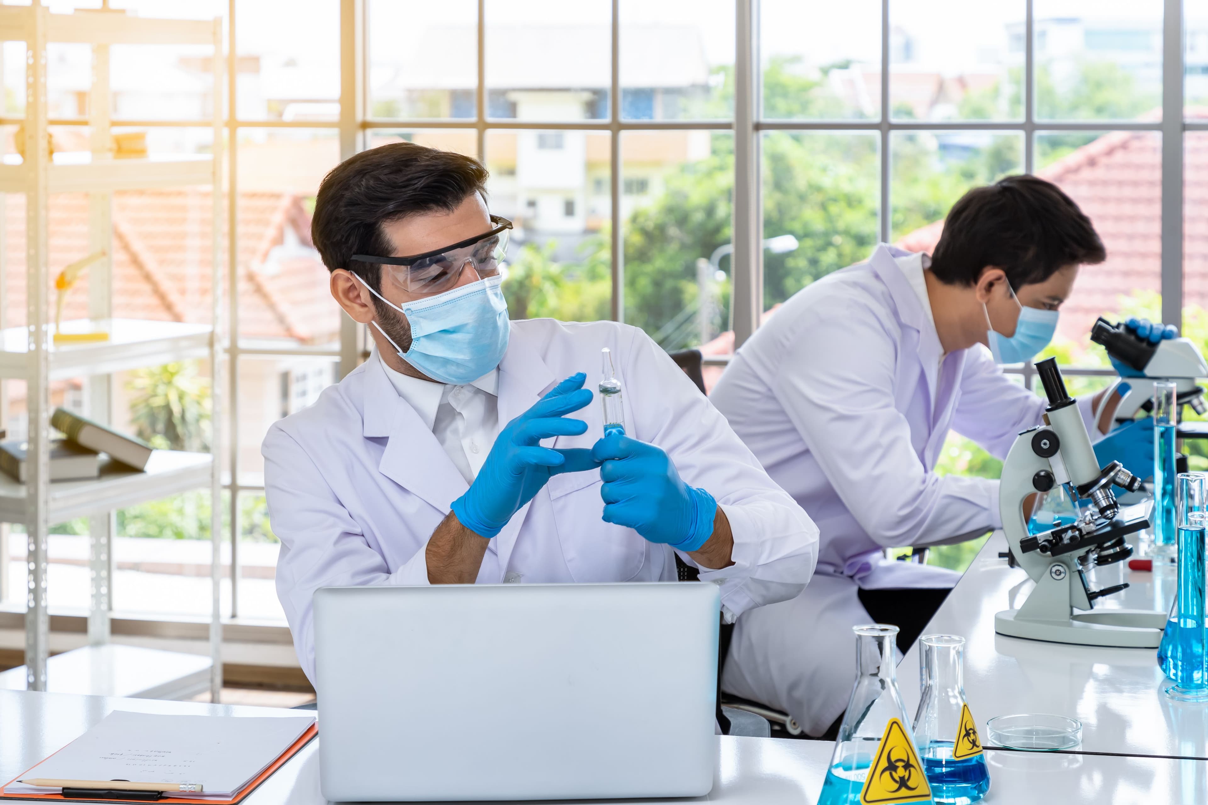 Medical researchers conducting laboratory testing and pharmaceutical analysis with scientific equipment, supporting precision medicine, diagnostics, and healthcare innovation
